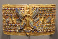 Armband with standing goddess of gold & glass at Museum Ägyptischer Kunst. Munich, Germany.