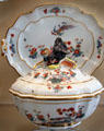 Meissen porcelain lidded terrine with handle in shape of wild boar painted with phoenix at Meissen porcelain museum at Lustheim Palace. Munich, Germany.
