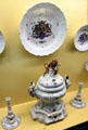 Meissen porcelain terrine with lion lid handle by Johann Joachim Kaendler plus other pieces from Graf Sulkowski table service at Meissen porcelain museum at Lustheim Palace. Munich, Germany.