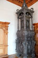 Antique cast iron room-heating stove at Augsburg Rathaus. Augsburg, Germany.