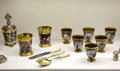 Drinking vessels with painted scenes & gold trim made by Nymphenburg Porcelain of Munich at Maximilian Museum. Augsburg, Germany.