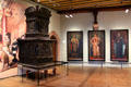 Germanic ruler paintings by Rudolf von Seitz beside tile room oven at Imperial Castle. Nuremberg, Germany.
