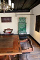 X-chair beside inlaid table with tile stove beyond at Albrecht Dürer's House. Nuremberg, Germany.