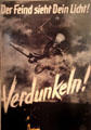 Blackout poster of death on a British bomber with slogan "the enemy sees your light! Darken!" at Nuremberg Transport Museum. Nuremberg, Germany