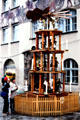 Giant rotating Christmas pyramid at Christmas Market on City Hall square. Nuremberg, Germany.