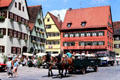 Wagon & pair of horses carrying visitors through historic center. Dinkelsbühl, Germany