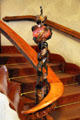 Wrought iron newel post & carved wooden balustrade detail at Casa Batlló. Barcelona, Spain.