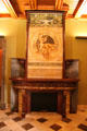 Fireplace on third level of Palau Güell with artwork on mantle. Barcelona, Spain.