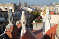 Chimneys of Palau Güell look out on Barcelona. Barcelona, Spain.