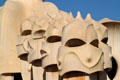 Row of helmeted chimneys atop Casa Milà. Barcelona, Spain.
