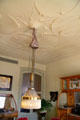 Textured ceiling & chandelier in dining room of museum apartment at Casa Milà. Barcelona, Spain.