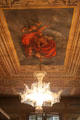 Chandelier hanging from ceiling mural at Palau Reial. Barcelona, Spain.