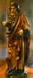 Wooden statue of St Anthony the Great with pig at his feet from upper Rhine in Unterlinden Museum. Colmar, France.