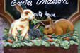 Rabbits on painted shop sign. Riquewihr, France.