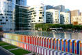 Defense Place pool with rainbow walls with base of Cur Défense building beyond at La Défense. Paris, France