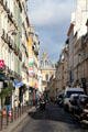 Rue Mazarine in Latin Quarter with domed Institute de France at end. Paris, France
