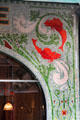 Mosaic detail of Boissonnerie shop front on rue de Seine. Paris, France.