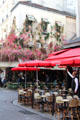 Rue de Buci streetscape in Latin Quarter. Paris, France