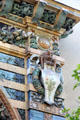 Detail of upper right corner with 1900 date of arch over owl & plaque with poppies on Sevres Arch at St-Germain-des-Prés. Paris, France