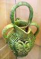 Glazed earthenware jug with 3 handles incised with two-headed eagle from Saintonge, France at Sèvres National Ceramic Museum. Paris, France.