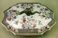 Chinese porcelain covered soup tureen from Jingdezhen with further painting by factory Guillebaud of Rouen, France at Sèvres National Ceramic Museum. Paris, France.