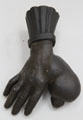 "To the Millionaire", symbol used by an itinerant bread & milk seller who had the idea to mold his deformed hand for his sign at Carnavalet Museum. Paris, France.