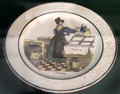 The Grocer one of a set of plates decorated with food shopping scenes, Choisy-le-Roi fine earthenware made by Valentin Paillart & Hippolyte Hautin at Carnavalet Museum. Paris, France.
