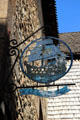 Old metal sign with a sailing ship advertising hotel along Grande Rue. Mont-St-Michel, France.