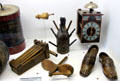 Wooden noisemakers, carved foot-like sabot shoes, bottle dryer & clock at Museum of Normandy. Caen, France.