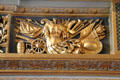 Carved relief of arms & armor in dining room at Cheverny Chateau. Cheverny, France.
