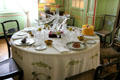 Dining table with glass deer head in family dining room at Cheverny Chateau. Cheverny, France.