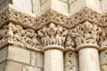 Replica with original sections of Medieval stone carvings around front entrance at Fontevraud Abbey. Fontevraud, France.