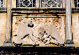 Katholikon, detail carving of lion bringing down deer on window frame in Ossios Loukas. Greece.