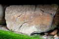 Neolithic carved stone with river-like design at Knowth. Ireland.