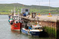 Fishing boat tied up to pier at Dingle. Dingle, Ireland.