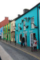 The Dolphin Shop with facade decorated with sculptures of dolphins in Dingle. Dingle, Ireland.