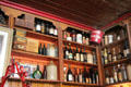 Liquor bottles & vintage shop items on shelves at Dick Mack's Pub in Dingle. Dingle, Ireland.