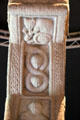 Carved cat & two faces on figure 8 on edge of ring of Cross of Scriptures at Clonmacnoise museum. Ireland.