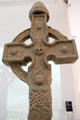 Details of Celtic knots on plaster replica of north high cross from Ahenny in County Tipperary at Medieval Mile Museum. Kilkenny, Ireland.