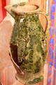 French green-glazed ceramic wine jug at Museum of Treasures. Waterford, Ireland.