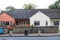 Pink building with slate roof. Adare, Ireland.