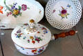 Meissen porcelain serving dishes painted with flowers at Pitti Palace Ceramics Museum. Florence, Italy.