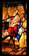 Flight into Egypt in stained-glass scene in Duomo. Milan, Italy.