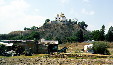 Church sitting on top of an earth mound which conceals largest pyramid in world, Cholula. Mexico.