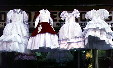 Confirmation dresses hang in front of a store in Puebla. Mexico.