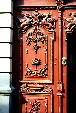 Detail of a red carved door in Puebla. Mexico.