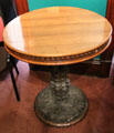 Round carved oak table made from rafters of Crochallan Club of Edinburgh which Burns frequented at Writers' Museum. Edinburgh, Scotland.