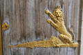 Royal lion over Royal Mile profile of Edinburgh on entrance doors at Queens Gallery. Edinburgh, Scotland.