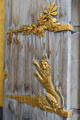 Royal lion under spray of leaves on entrance doors at Queens Gallery. Edinburgh, Scotland.
