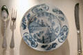Earthenware plate after Chinese design from Delft with silverware made in Edinburgh at National Museum of Scotland. Edinburgh, Scotland.